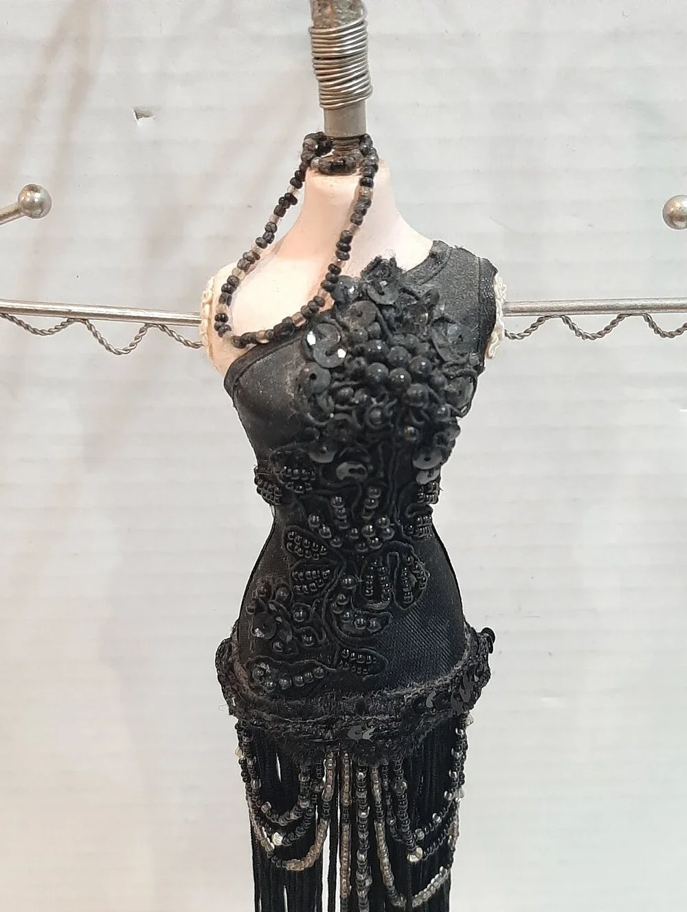 Black fringed flapper dress jewelry display stand